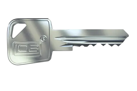 Metalowy klucz z wytłoczonym logo "IOB" i symbolem "R". To klucz do systemu jednego klucza, który otwiera wiele zamków.